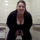 Mary Crap takes a shit while straddling a toilet in a public restroom while Assley films. You can see the shit coming out, and she shows us the shit after moving the toilet paper aside with a plunger. They describe the smell and contents of the turd.